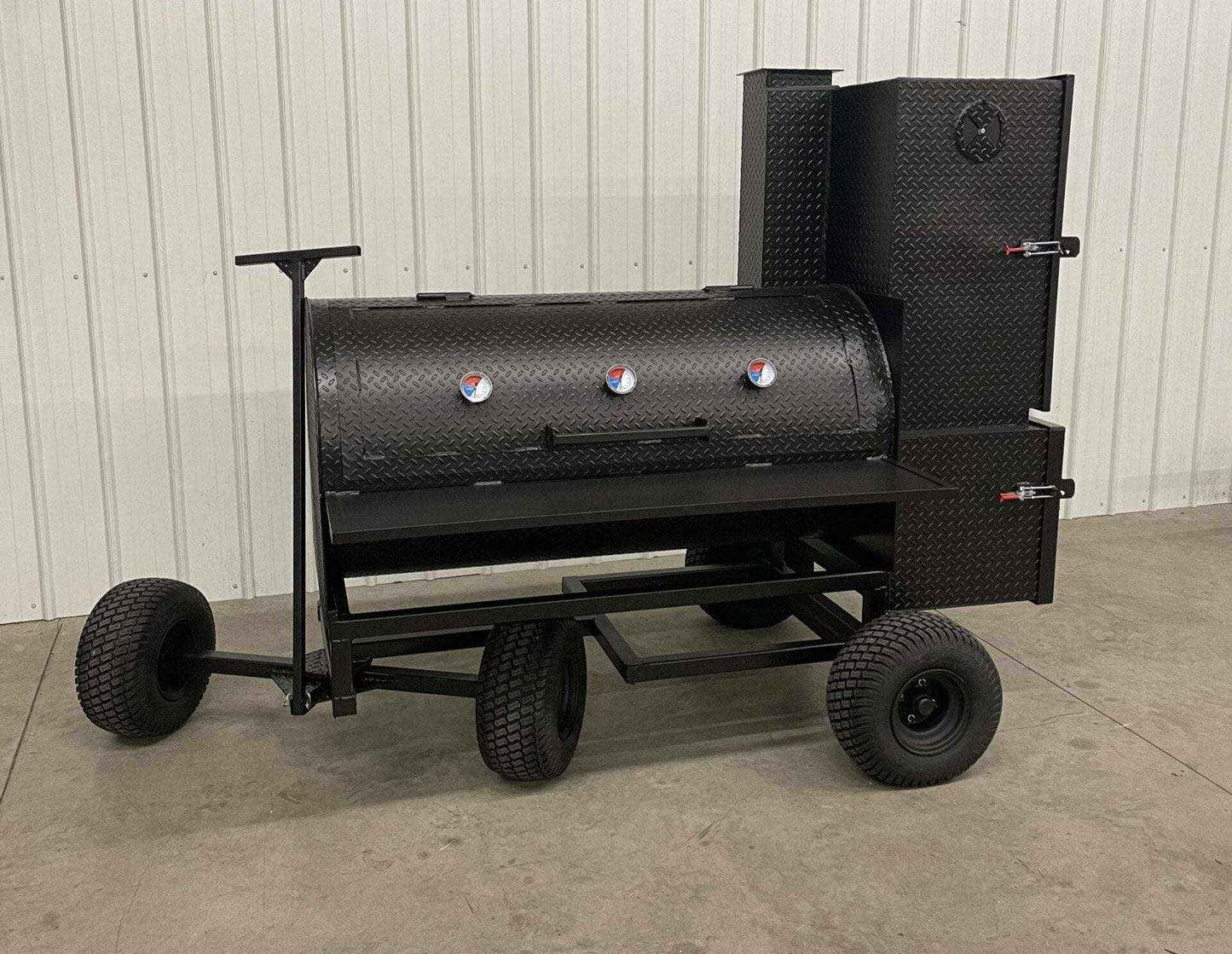 SNS Competition Smoker wagon-style steel smoker with insulated firebox and multiple temp gauges for large-capacity cooking