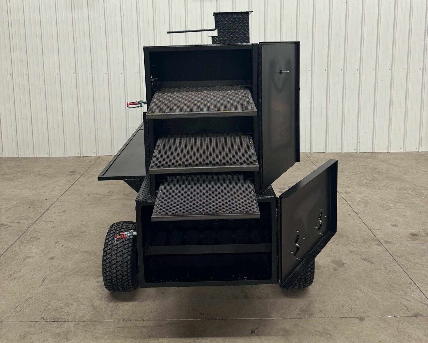 SNS Competition Wagon Backyard BBQ Smoker with multiple cooking racks, insulated firebox, rib/warming box, charcoal grill, and wagon chassis for easy mobility