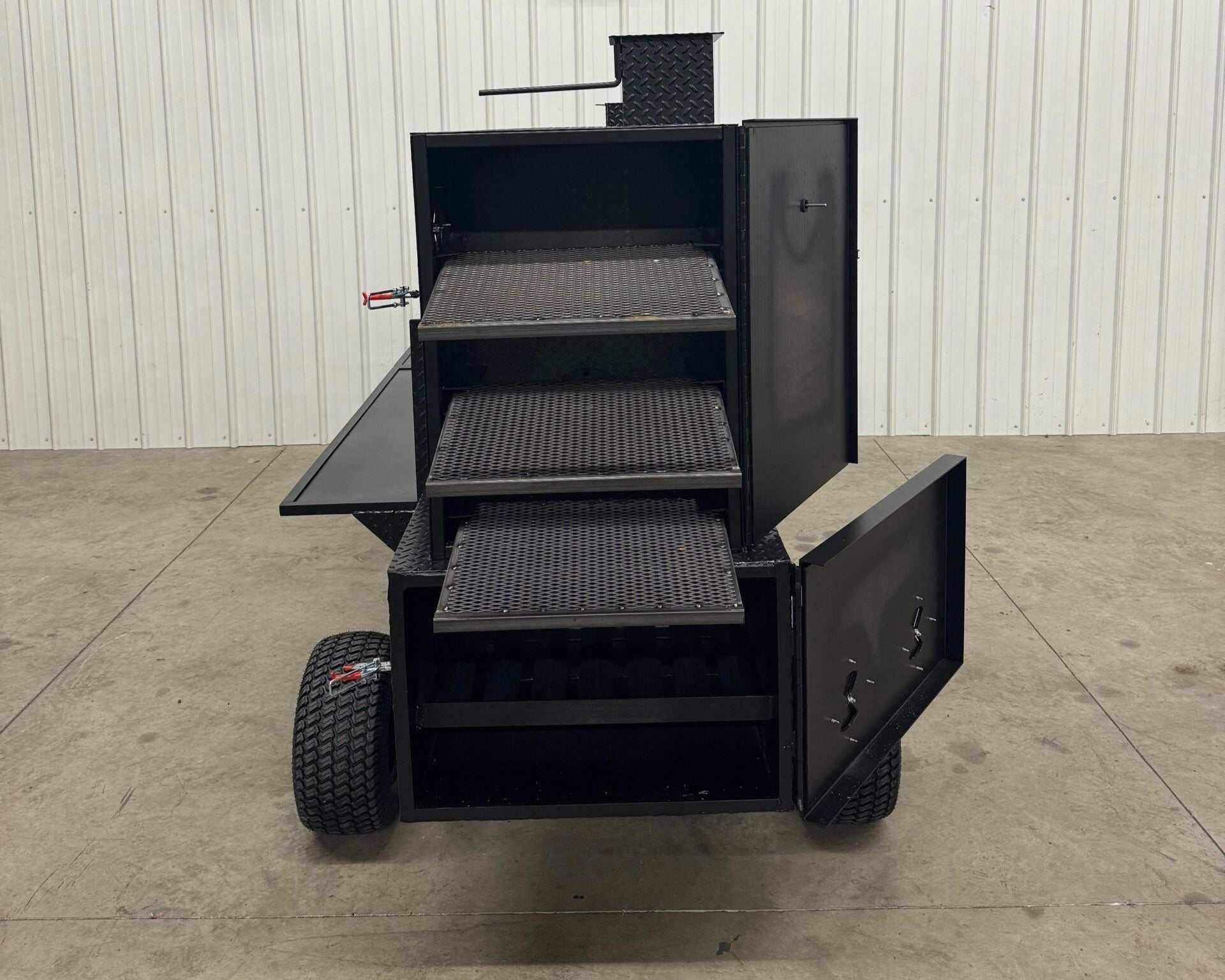 SNS Competition Wagon Backyard BBQ Smoker with multiple cooking racks, insulated firebox, rib/warming box, charcoal grill, and wagon chassis for easy mobility