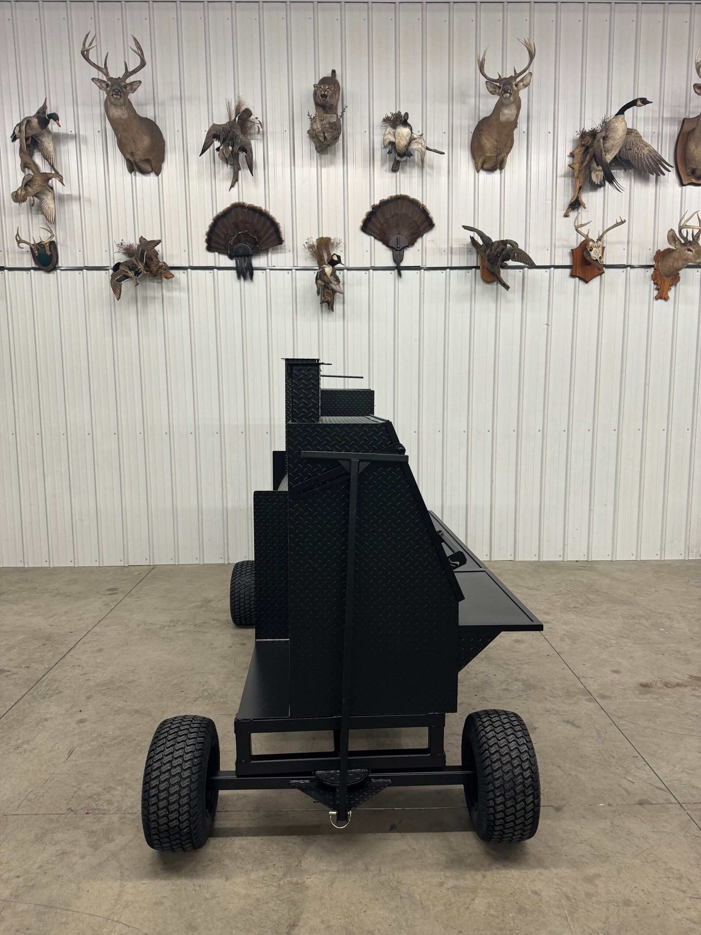 SNS Competition Wagon Smoker with grill and wagon chassis in black diamond tread steel with large wheels for easy transport