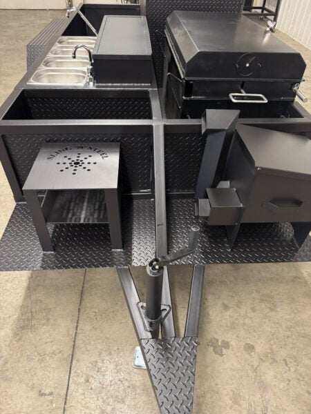 SNS Deluxe 72 Catering Trailer Smoker with multiple cooking racks, sink system, and insulated firebox for versatile BBQ catering use