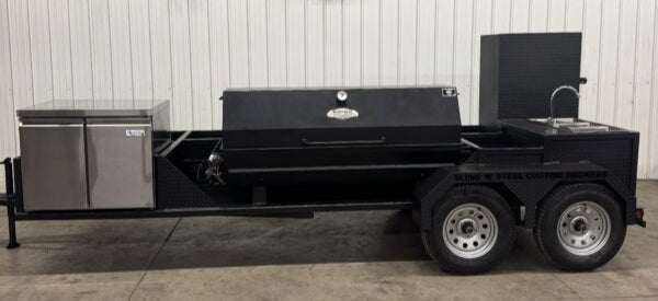 SNS Hospitality Trailer BBQ trailer with propane grill, refrigerator, sinks, and large cooking capacity for events and catering.