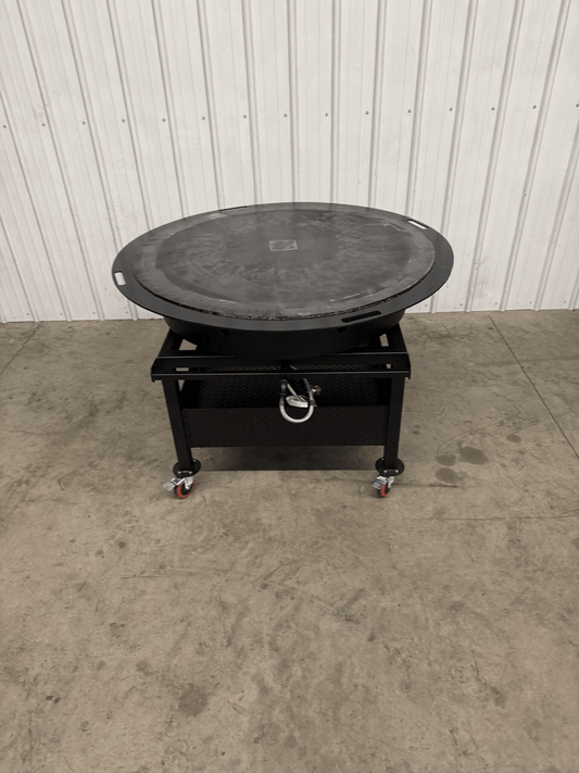 Portable Griddle SNS Mega Griddle with extra-large rotating cooking surface on wheeled stand for outdoor use