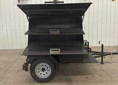 SNS Mega Grill large dual-pit grilling trailer for BBQ catering with pull-out charcoal trays and frying stand
