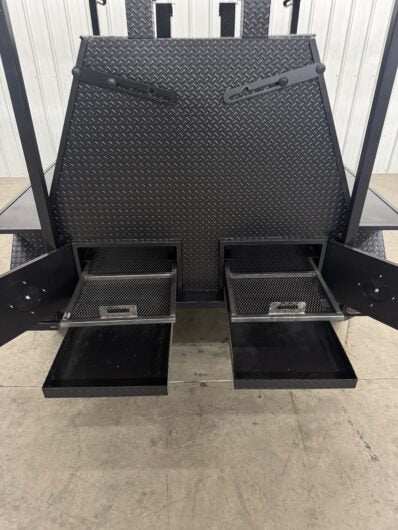 Dual charcoal grills with pull-out trays and ash pans on SNS Mega Giant Grill trailer with roof package