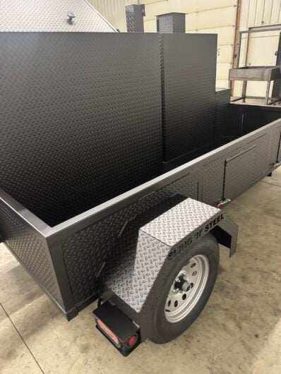 SNS Pellet Vault and charcoal grill combo trailer with pull-out charcoal tray, dual cooking racks, fryer stand, and storage, ideal for catering and BBQ business use