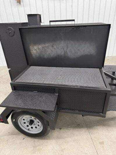 SNS Smoke House Smoke Cabinet smoker with large main chamber, flat grill, warming box, and trailer features