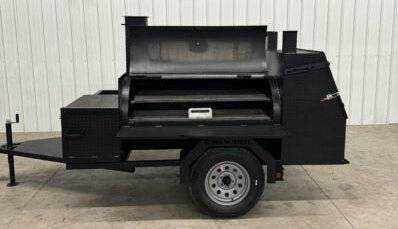 Custom BBQ trailer with dual cooking pits, pull-out charcoal trays, storage area, and smoker tank for catering and personal use