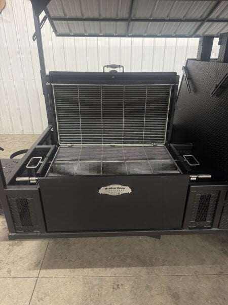 SNS Ultimate Mega Grill commercial charcoal grill trailer with dual-sided grilling chamber and pull-out charcoal trays under a roofed structure