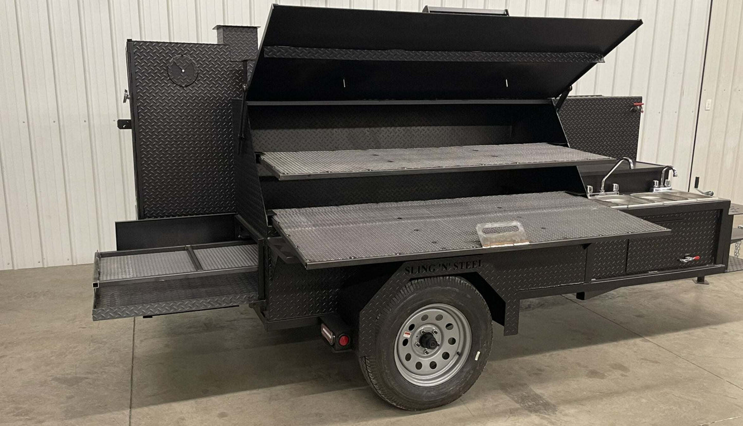 Mobile SNS Ultimate Smokehouse 60 inch with griddle, sink, multiple cooking racks, warming box, double steel firebox, and pullout charcoal tray.