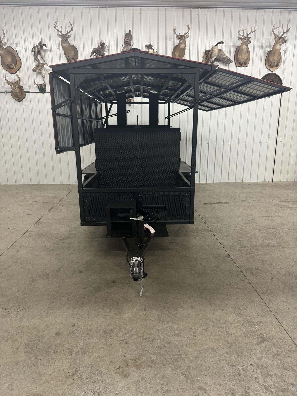 Front view of the Avery commercial cabinet smoker with open side and roof panels, designed for large catering and restaurant use.