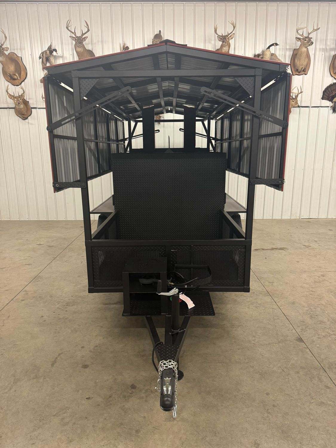 Commercial Avery cabinet smoker trailer with large cooking chamber and steel frame for catering events and restaurants