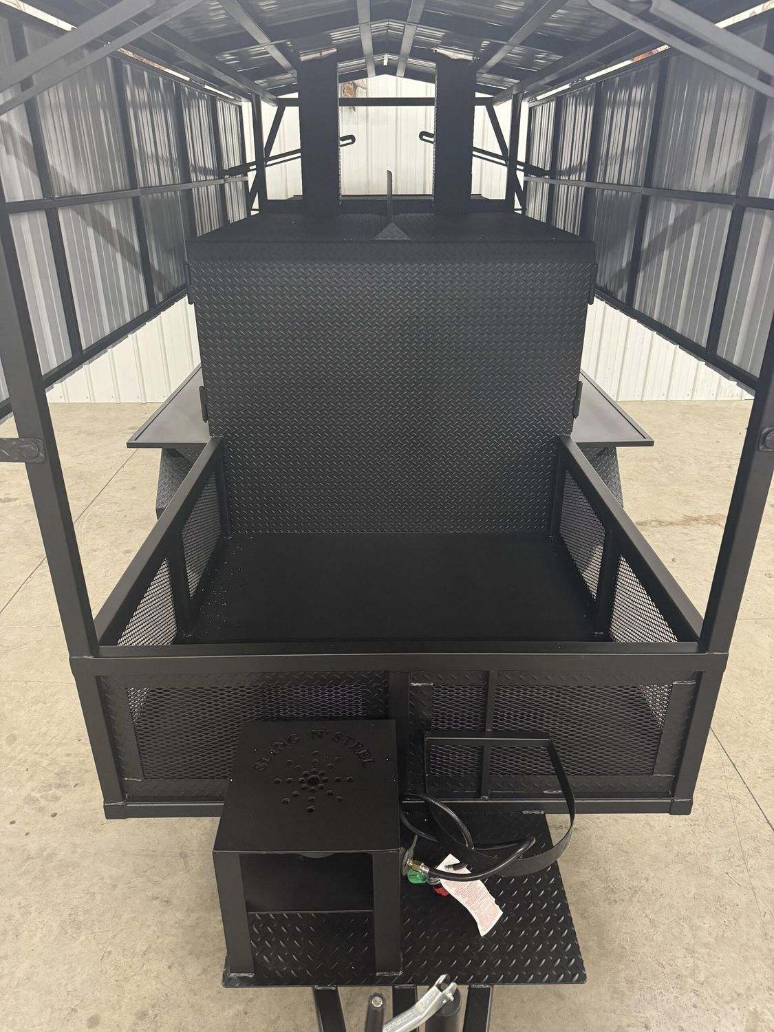 Large commercial Avery cabinet smoker with double-walled steel construction and multiple cooking racks