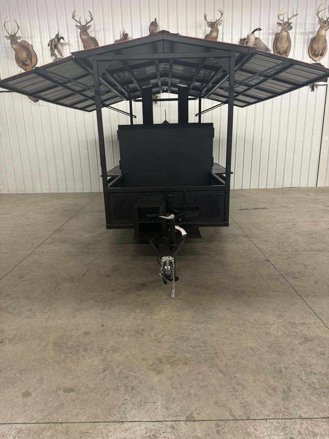 Commercial Smoker Avery with large cooking chamber, rib warming box, storage area, fryer stand, and trailer setup