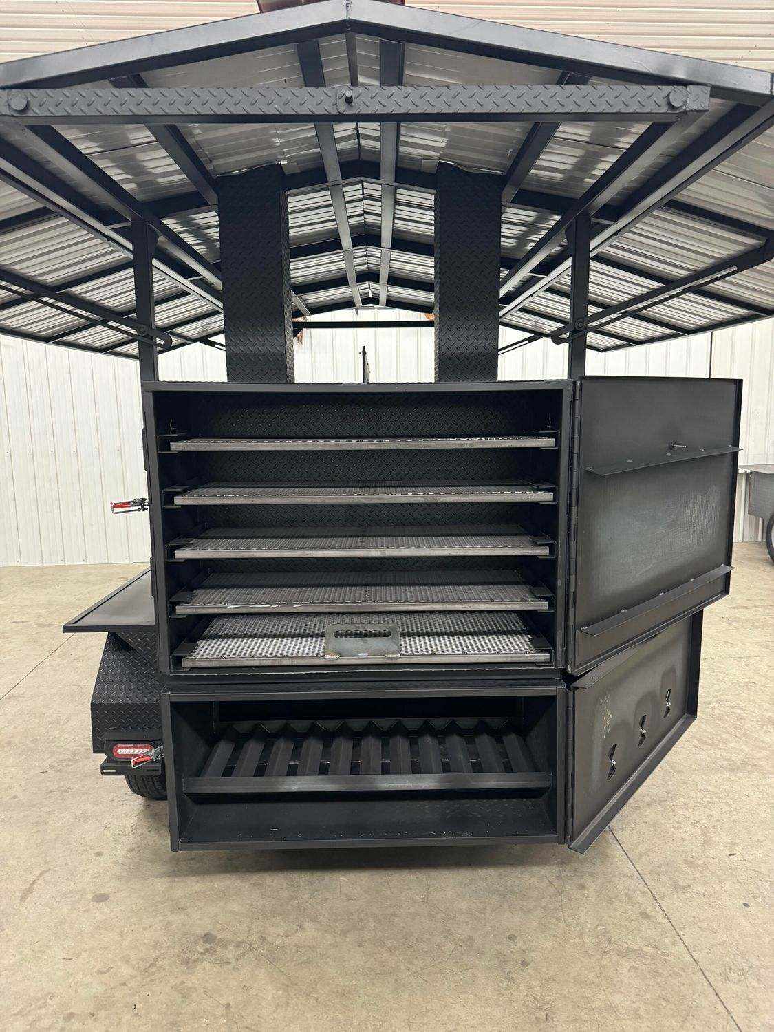 Commercial Smoker Avery with large cooking chamber, six racks, rib/warming box, storage area, and steel construction for catering and restaurant use