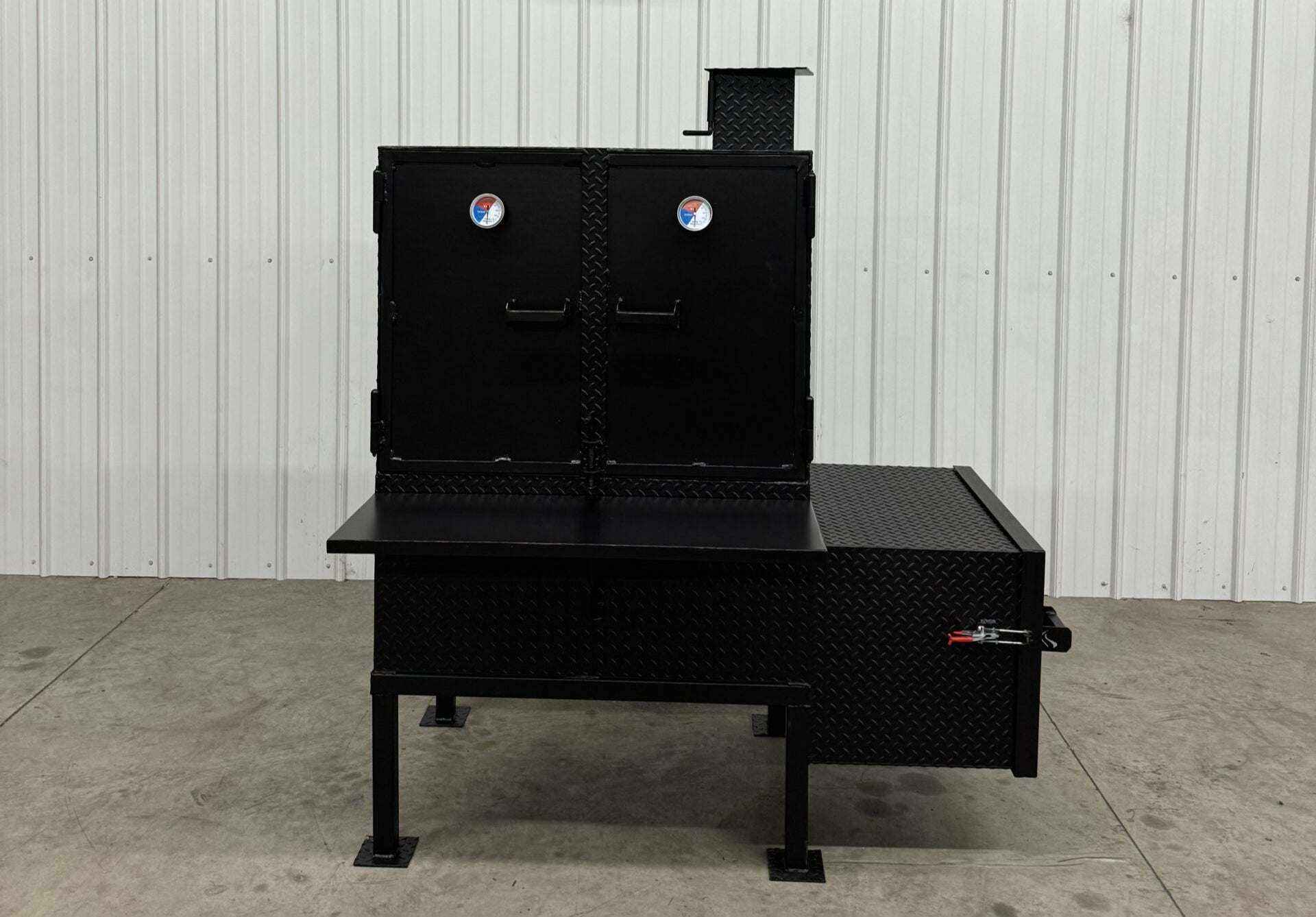 SNS 40 smoker cabinet with large 30x40 chamber, double-walled firebox, and reverse flow design for heavy-duty smoking.