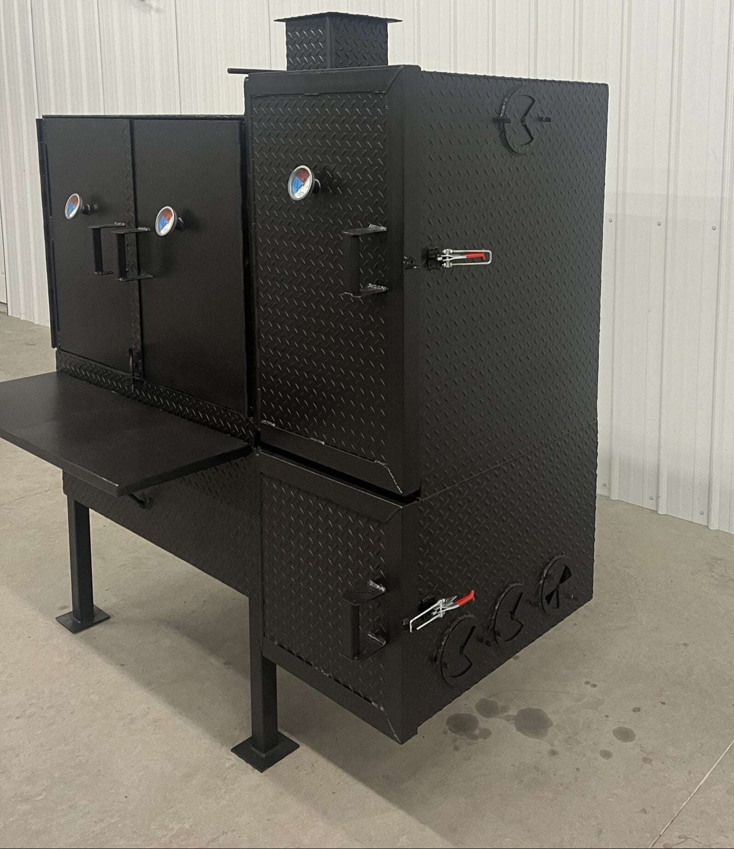 Heavy-duty black SNS 40 smoker cabinet with large 30x40 chamber and insulated firebox for patio or concession use