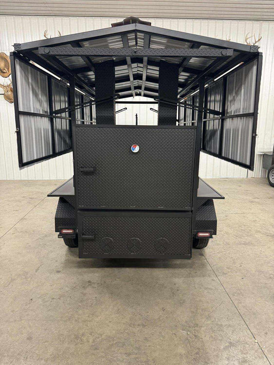 "Commercial Avery cabinet smoker with large cooking chamber and dual doors open in industrial setting"