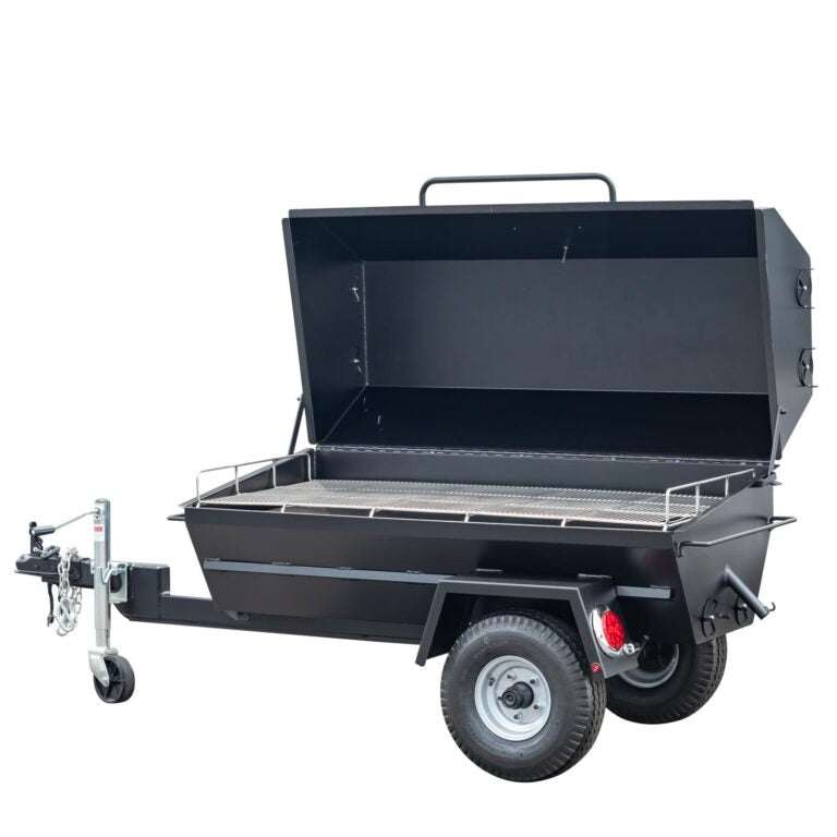 Black dump trailer with open bed on a white background