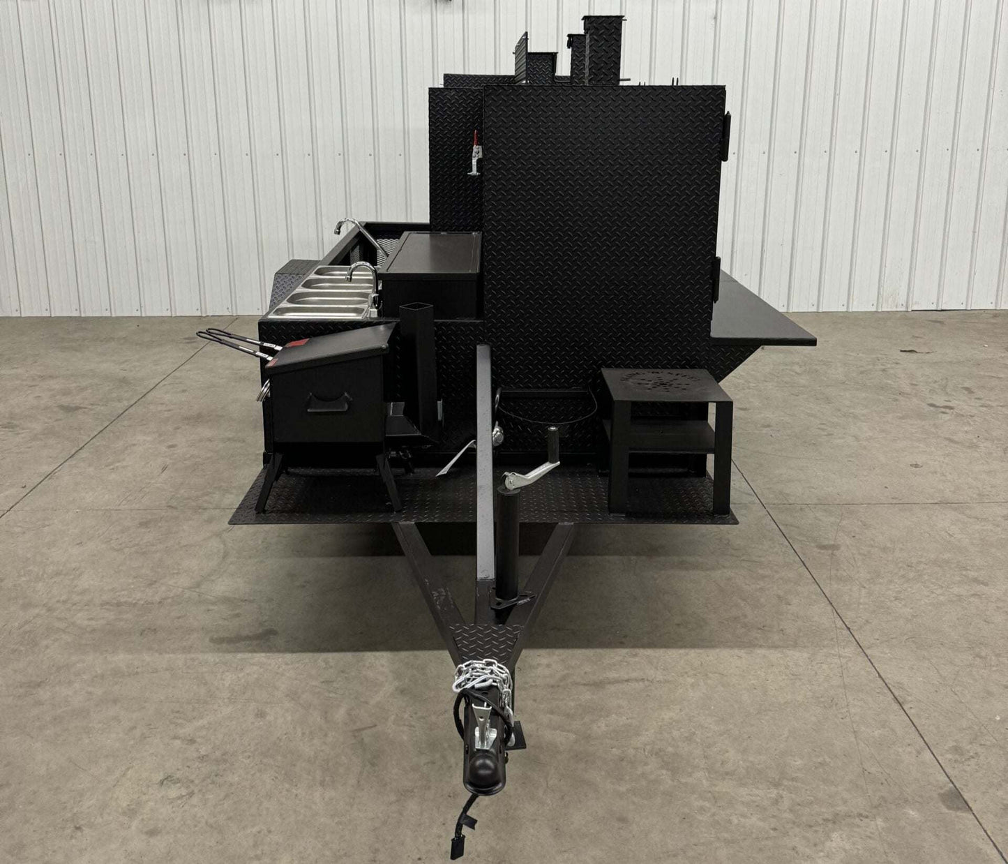 Custom charcoal grill and smoker trailer for versatile catering and restaurant use, designed for maximizing business profits.
