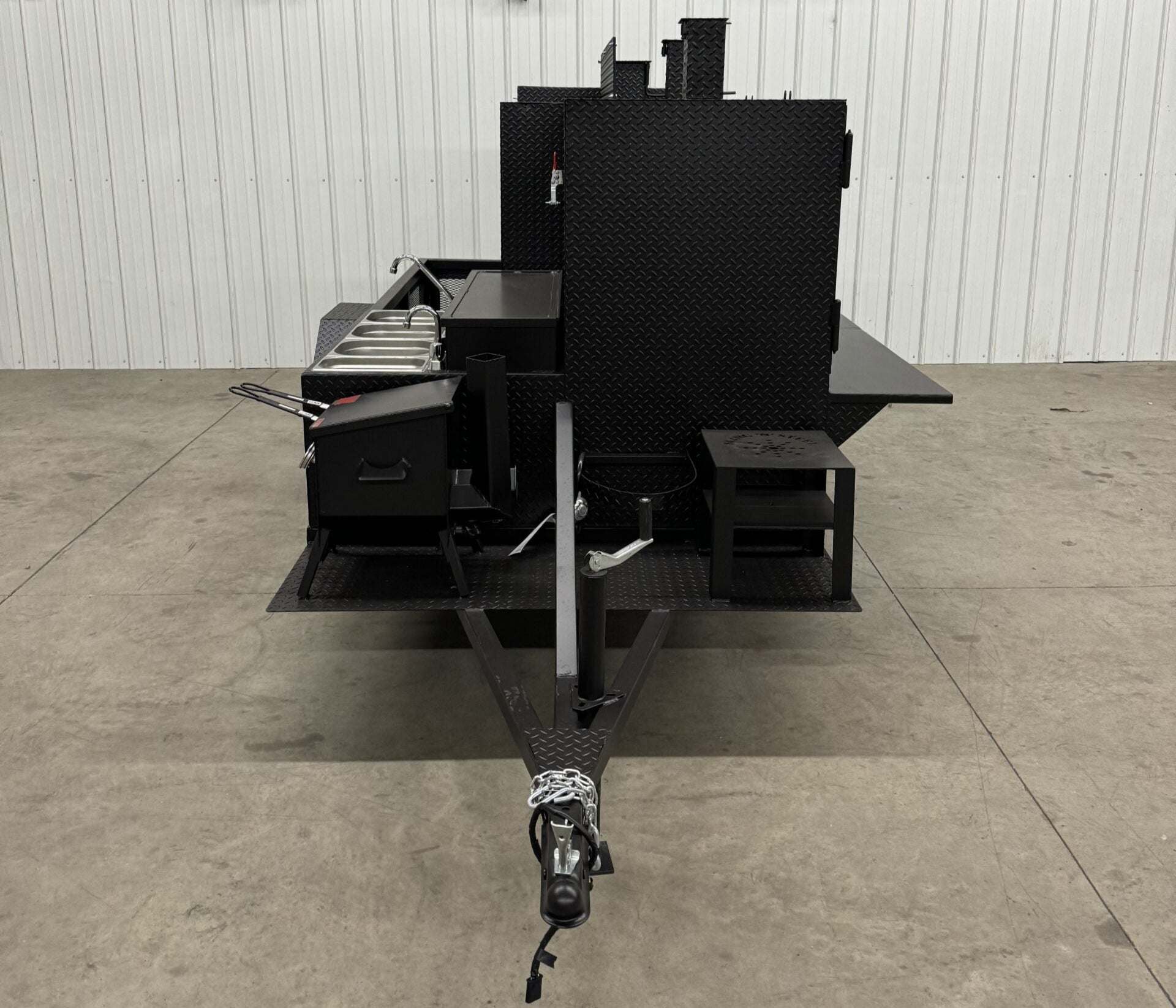 Custom charcoal grill and smoker trailer for versatile catering and restaurant use, designed for maximizing business profits.