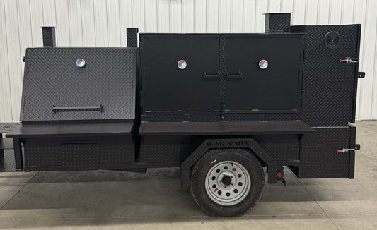 Black SNS 4060 smoker grill and cabinet main chamber with dual fryer stands and wheels for catering use