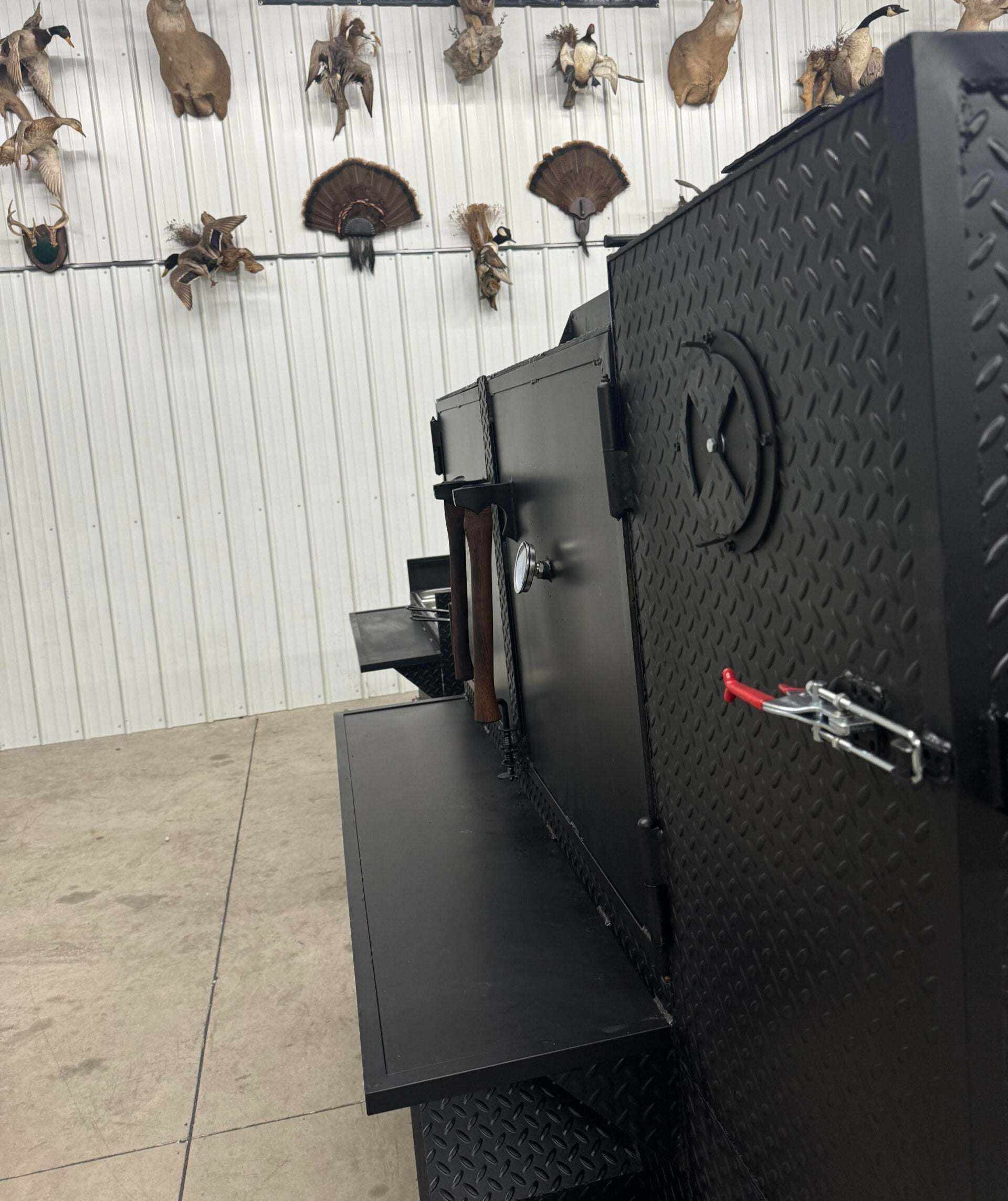 SNS 60 cabinet smoker with sink and deep fryer package made of 1/4 inch diamond tread steel with multiple cooking racks and insulated firebox.