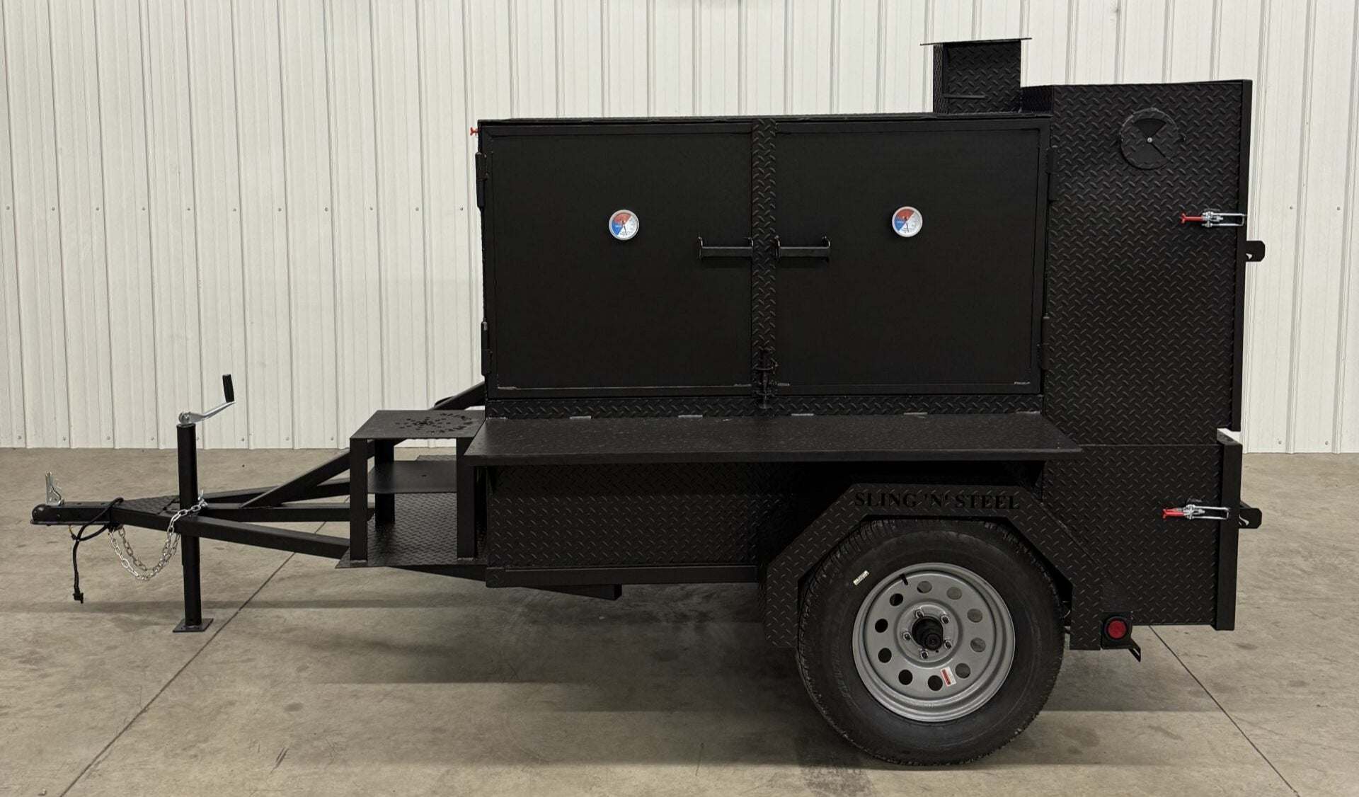 SNS Smoke House black steel smoke cabinet smoker trailer with large cooking chamber and flat grill