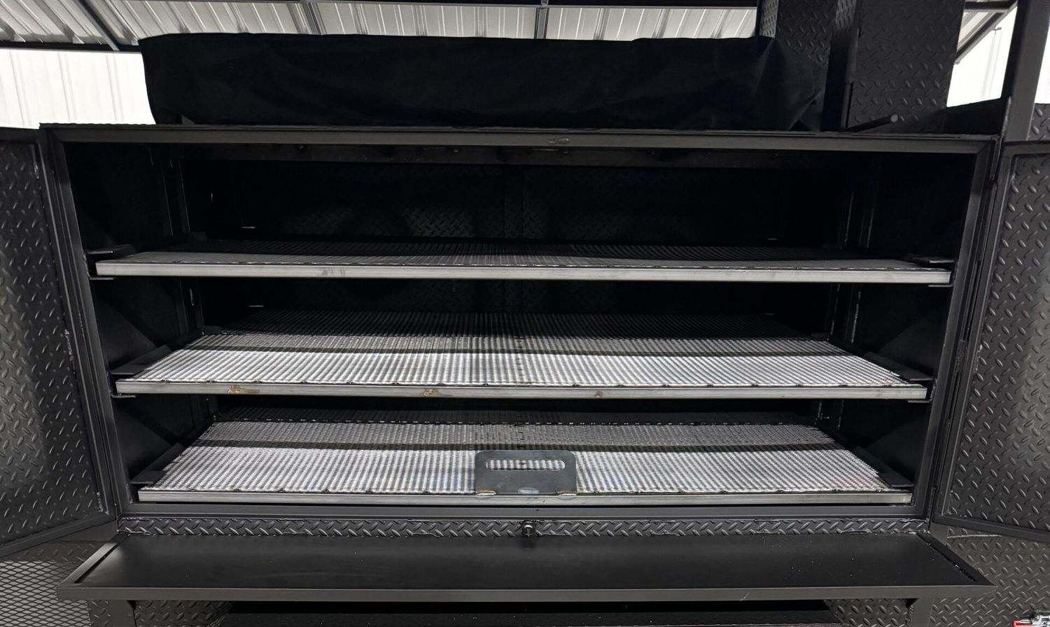 Commercial Avery Cabinet Smoker with three large cooking racks and spacious chamber for catering and restaurants.