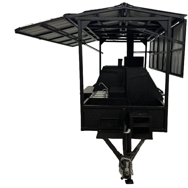A black outdoor patio catering trailer with a roof, side awning, and front hitch. 